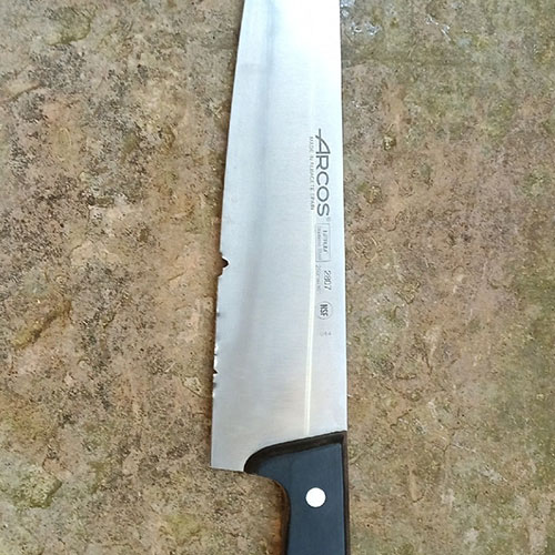 Knife blade with a chipped tip before repair